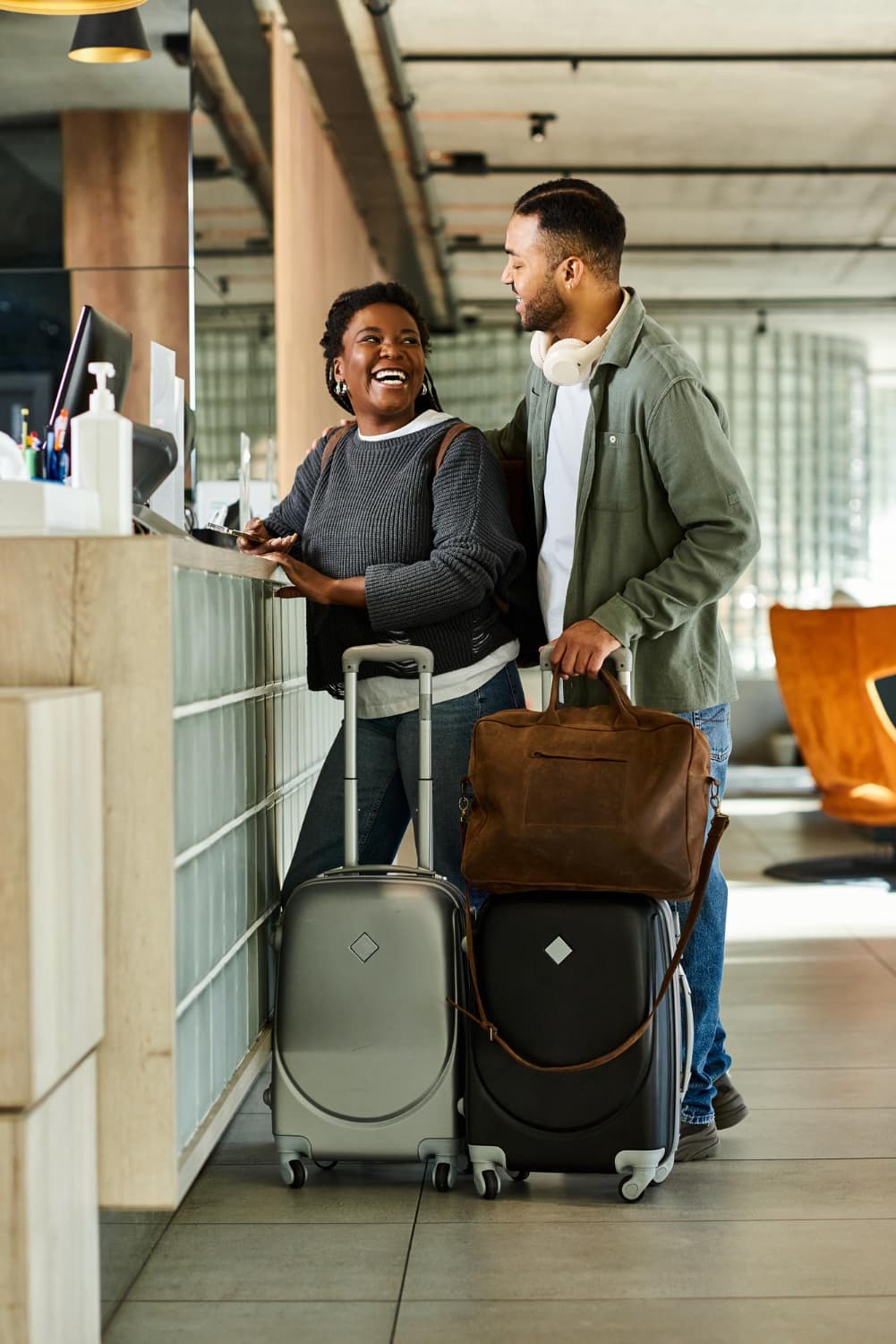 Travellers checking in at an airport counter