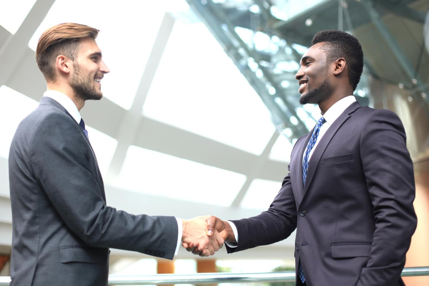 Account manager shaking hands with a client